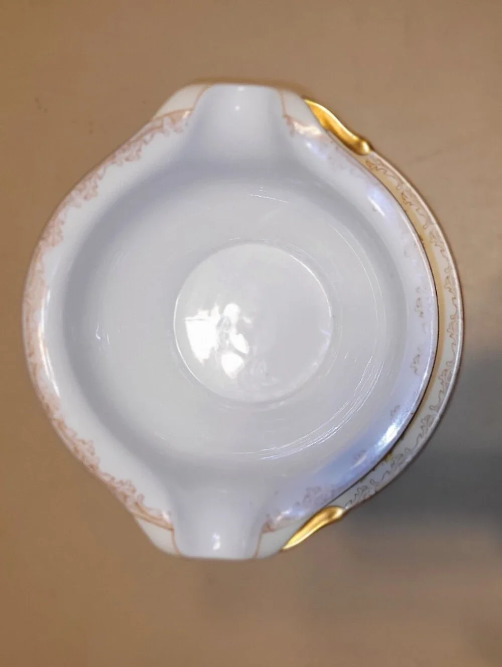 Meito China Hand Painted Porcelain Floral Gravy Boat with Attached Saucer.